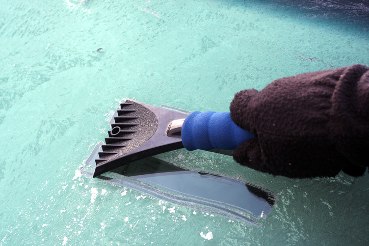 scraper on windshield